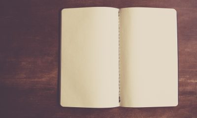 夜晚书房台灯下打开的笔记本电脑屏幕，展示一个视频分区导航界面